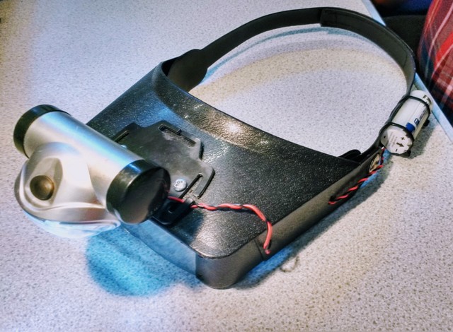 An example of ingenuity -  this is a homebrew headtorch with magnifier lenses!